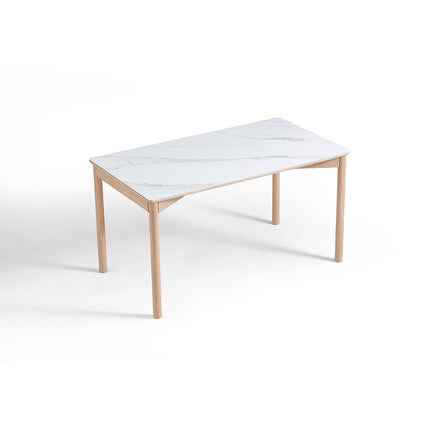 Rectangular table with white marble-like top and light wood legs on a white background