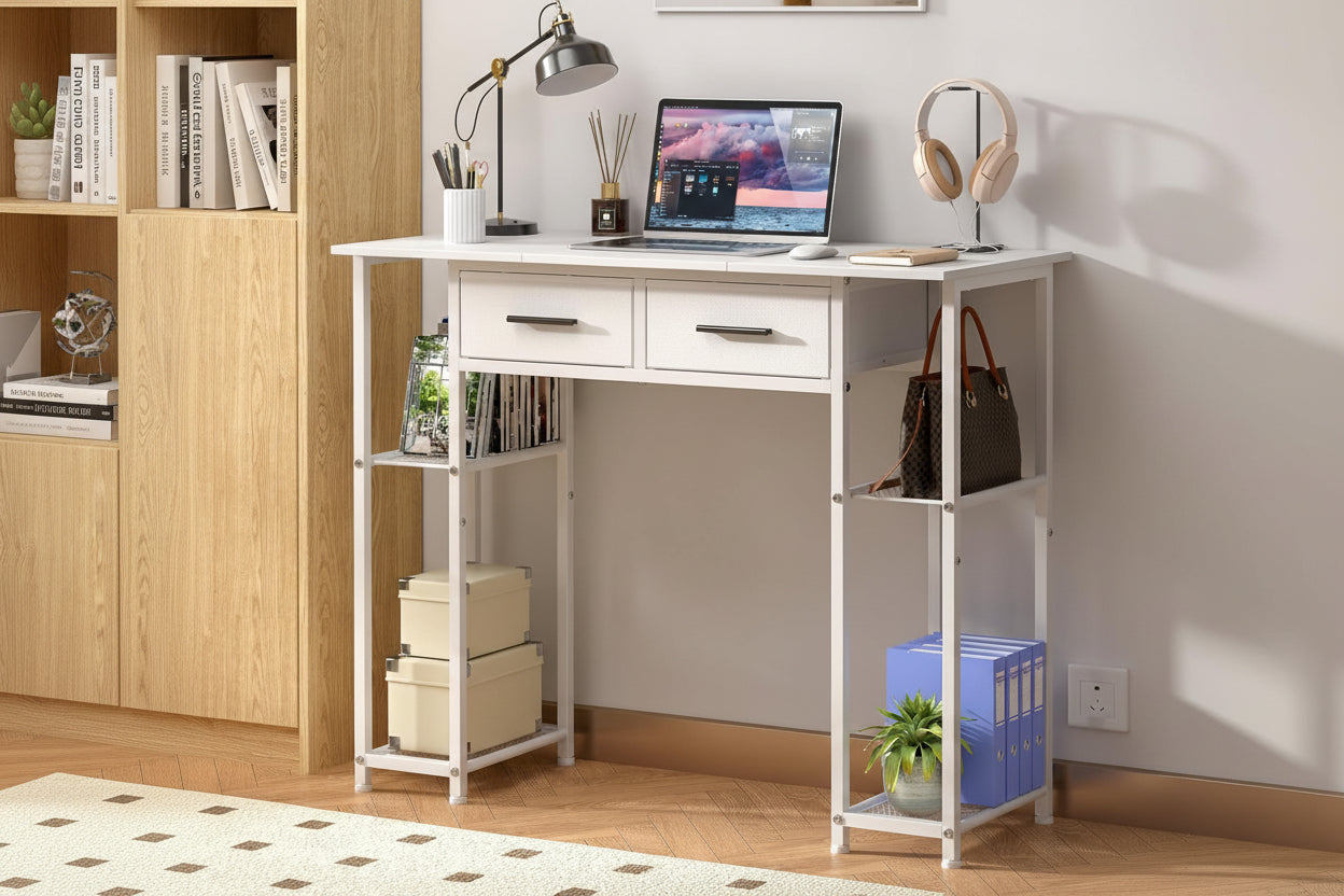 White desk with laptop, books, and office items in a room setting.