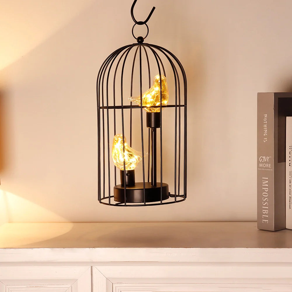 Decorative lamp with birdcage design on a shelf