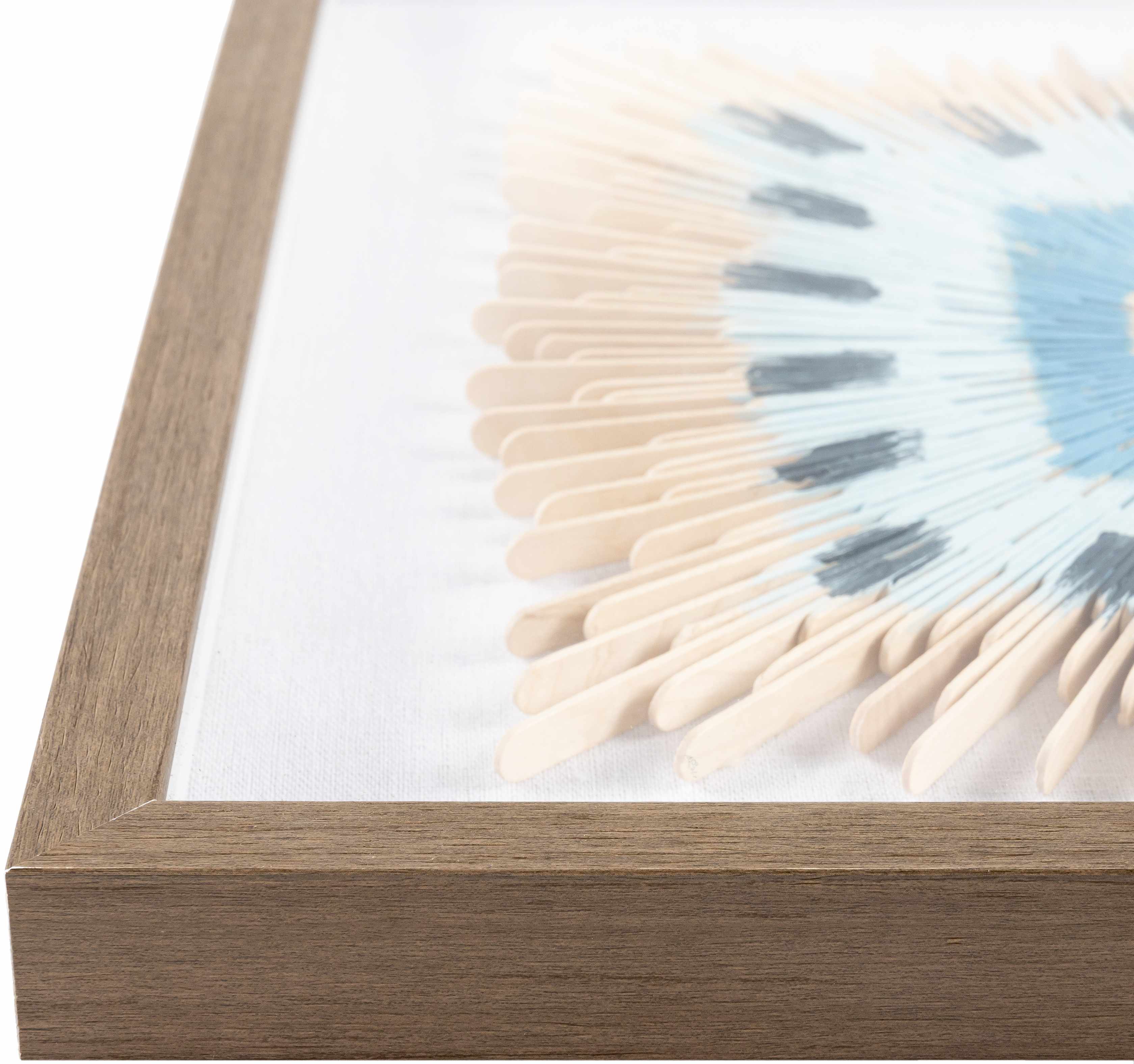 Framed artwork with a wooden frame and white mat displaying a tie-dye pattern.